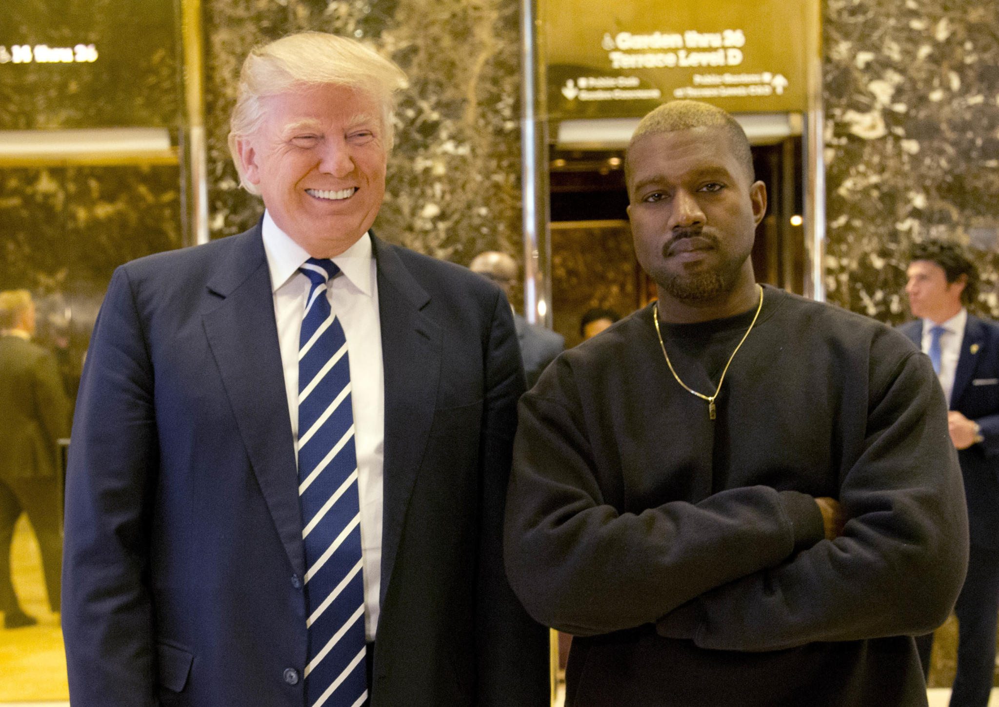 FILE - In this Dec. 13, 2016, file photo, President-elect Donald Trump and Kanye West pose for a picture in the lobby of Trump Tower in New York.  Kanye West will visit the White House on Thursday to meet with President Donald Trump and his son-in-law Jared Kushner talk about manufacturing in America, gang violence, prison reform and Chicago violence. (AP Photo/Seth Wenig, File)